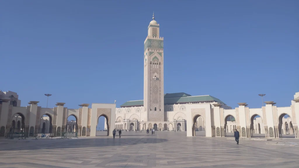 Casablanca vs Marrakech 2026: The Ultimate Guide to Morocco's Best Cities 2 Hassan II Mosque minaret and courtyard in Casablanca under a clear blue sky